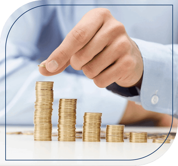 A person is putting money in stacks of coins.