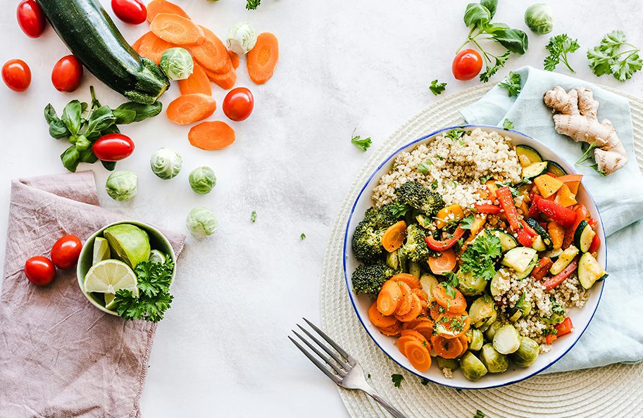 A bowl of food on top of a table.